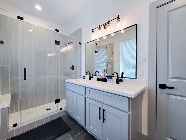 Building Photo - This 4-bedroom, 3-bathroom, two-story residence comes with a generous two-car attached garage. Re...