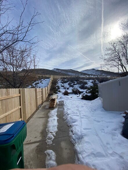 left side of house with storage shed - 17110 Waxwing Ct