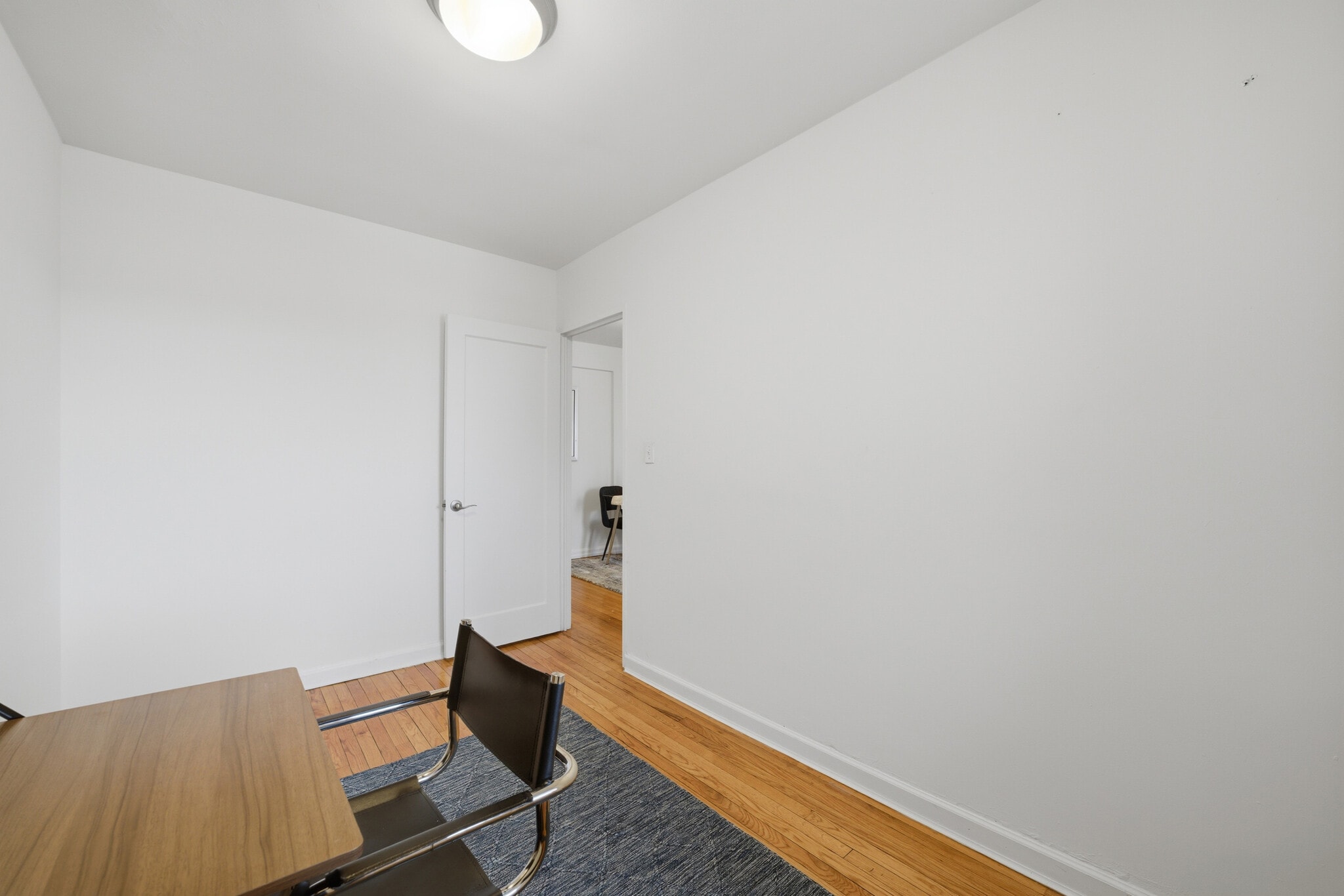 Bedroom with hardwood floors and a window overlooking the Hudson River, offering flexible use option - 555 Broadway