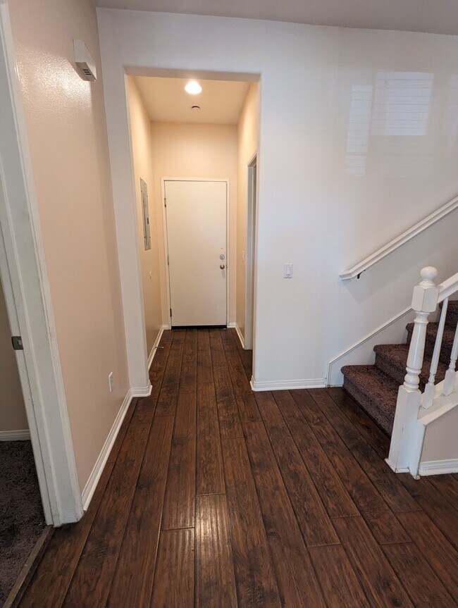 Hallway to garage, to downstairs room, to bathroom and to up stairs - 2911 Esperanza Way