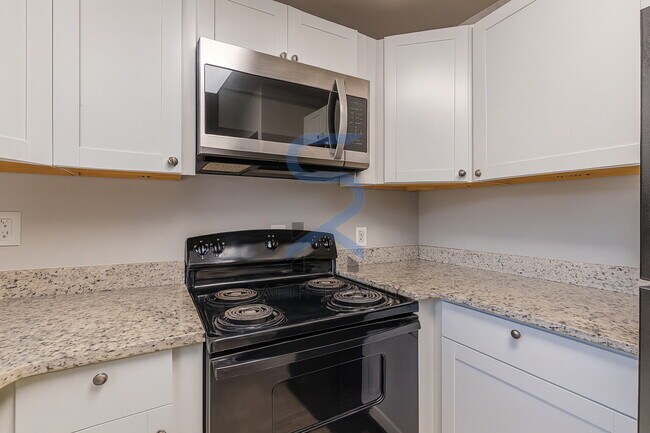 Building Photo - Move in before January 15th and choose your reward: a $250 Amazon Gift Card or a 55" Smart TV!