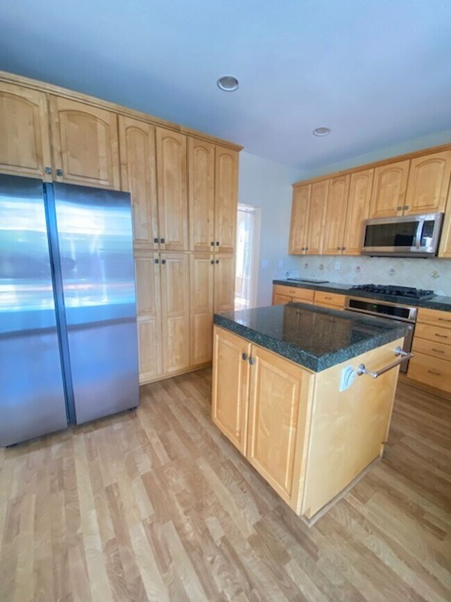 Building Photo - Spacious 5-Bedroom Home with Solar, Stunning Sunroom & Upgraded Bathrooms!