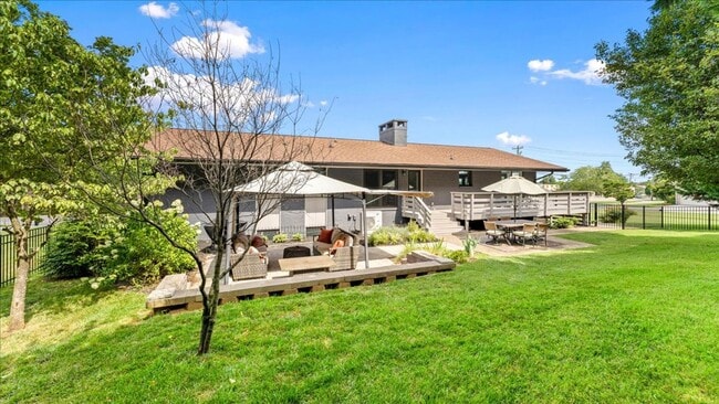 Building Photo - Renovated Mid-Century Modern Home in Belmont West with Finished Basement & Fenced Yard