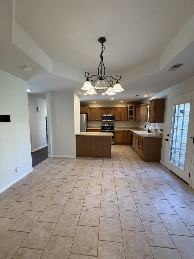 Building Photo - Spacious 3 BR with a fenced in backyard