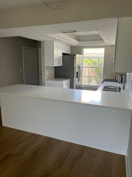 Kitchen With Large Quartz Countertop - 16251 Dublin Cir
