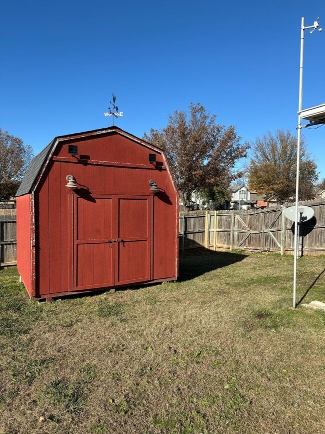 Building Photo - Clean, updated home on a corner lot with privacy fence and storage shed.
