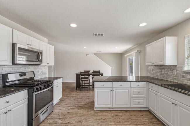 Building Photo - Gated Community Home with Solar Panels & All Appliances Included