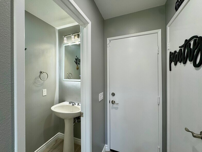 Downstairs powder room off kitchen and garage - 16224 Chadwick Ct