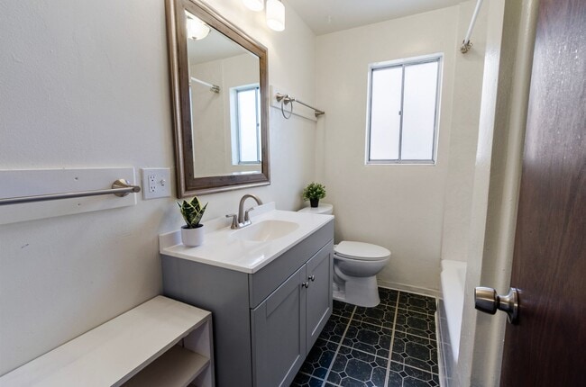 Building Photo - Available March 1, 2026. Updated 2 Bedroom 1.5 Bath Duplex with private dedicated pool.