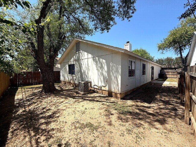 Building Photo - Move-In Ready 3BR/2BA: Updated Kitchen, New Light Fixtures & Fenced Yard