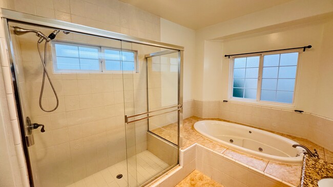 Primary bathroom - large tub with jets, full-sized shower, double sinks - 2107 Plant Ave