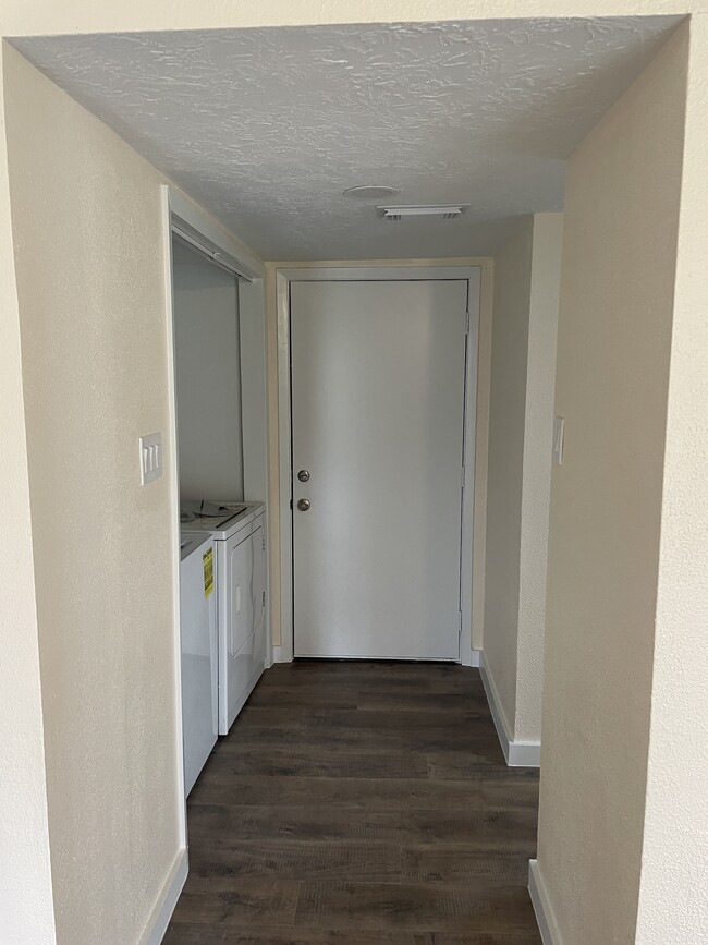 front door and laundry area - 15919 Golf Club Dr