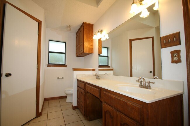 Building Photo - Corner Lot Charmer Off Chapel Creek | 4BR/2BA with Fireplace, Garden Tub & Fenced Backyard