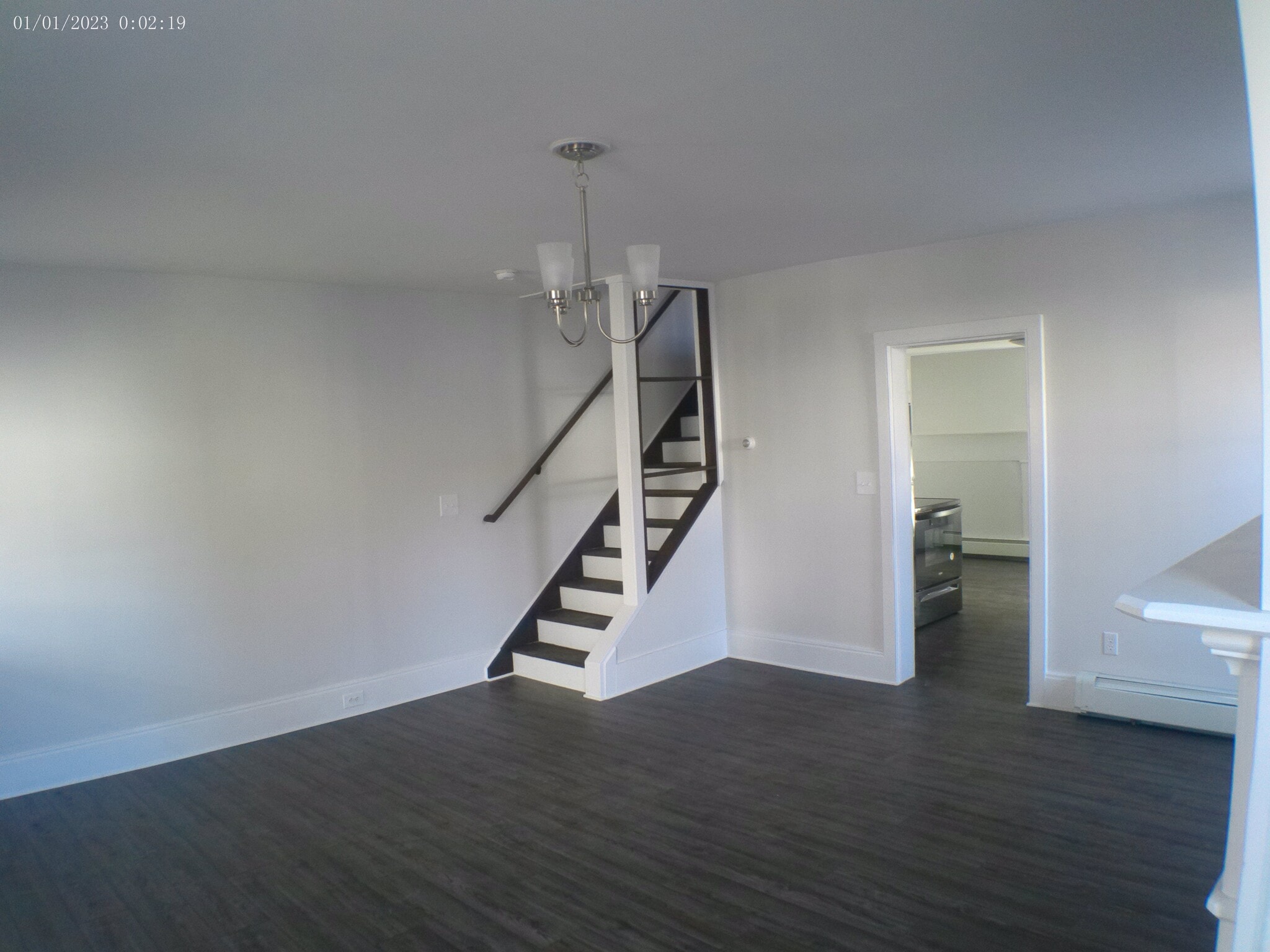 Living room staircase with built in shelvs. - 35 Main St