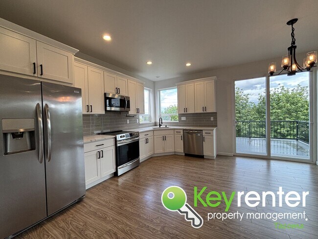 Building Photo - Stylish 4-Bedroom Home with Finished Basem...