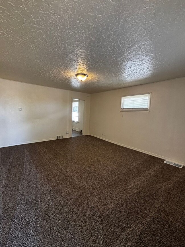 Building Photo - Quaint home with fully fenced yard and updates