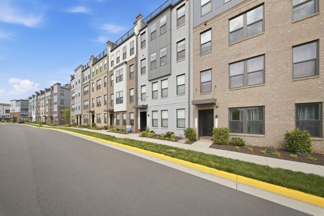 Building Photo - Perfectly positioned near the vibrant shopping and dining destination of One Loudoun, this reside...