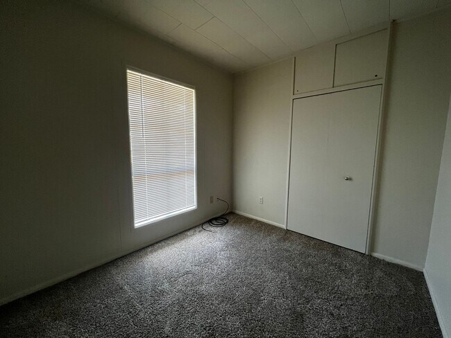 Building Photo - 3 Bedroom, 1.5 Bathroom, Brick Home with yard and Storage Building, Covered Porch