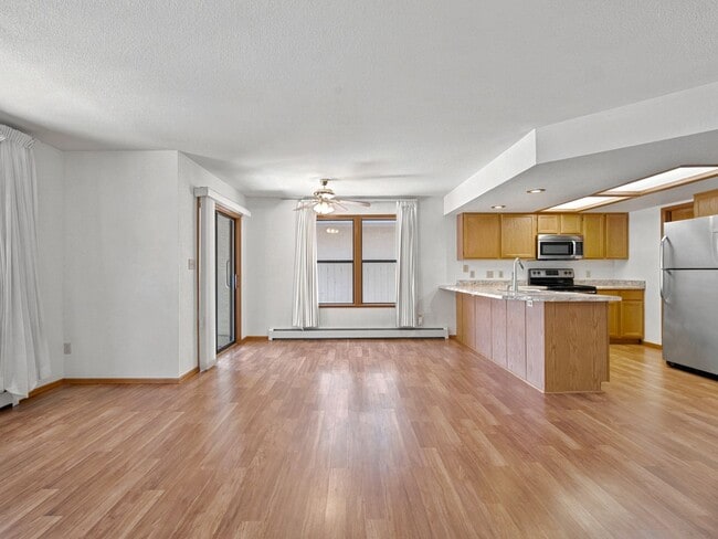Building Photo - Spacious 2BR Rental with Open Floor Plan & Low-Maintenance yard