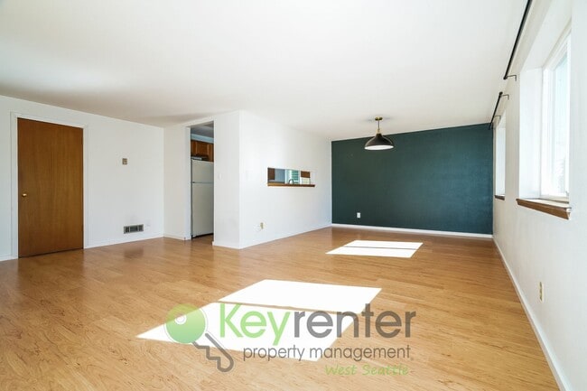 Building Photo - **Rent Special** Remodeled Two-Bedroom with Open Floor Plan, Parking, and Easy Transit Access