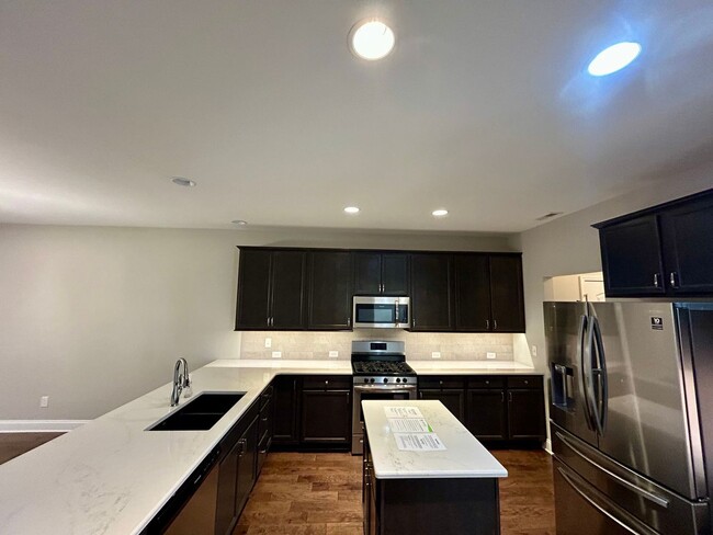 Building Photo - Spacious 3 bed, 3 bath home in Groves Park Commons featuring a modern kitchen, 2-car garage, and ...