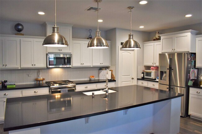 Building Photo - Solar powered open concept home located in...