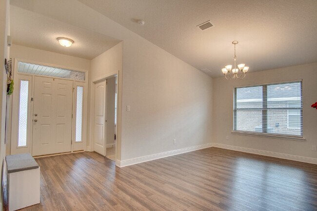 Building Photo - Spacious 4BR/2BA Brick Home with 2-Car Garage, Granite Kitchen, Vaulted Ceilings & Fully Fenced B...