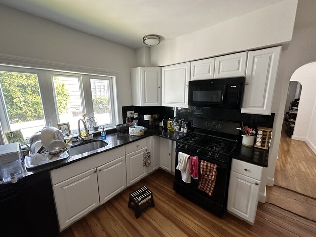 Updated kitchen. All stainless steel appliances, Brazilian granite countertop, shaker cabinets. - 58 S Waverly St