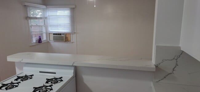 Quartz bar top & window A/C - 5042 Sawtelle Blvd