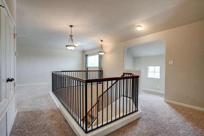 Building Photo - Bright & Roomy 4BR • 2.5BA • Two-Level Living