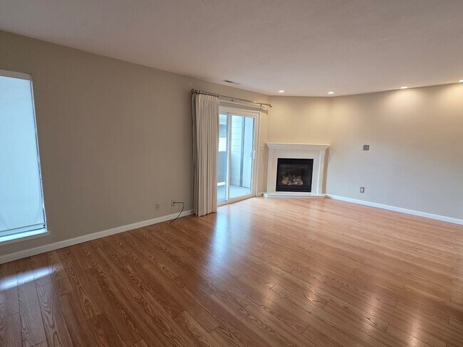Building Photo - Spacious 2BR Condo with Central A/C, Bonus Room & Huge Storage – Walk to Burlingame Avenue