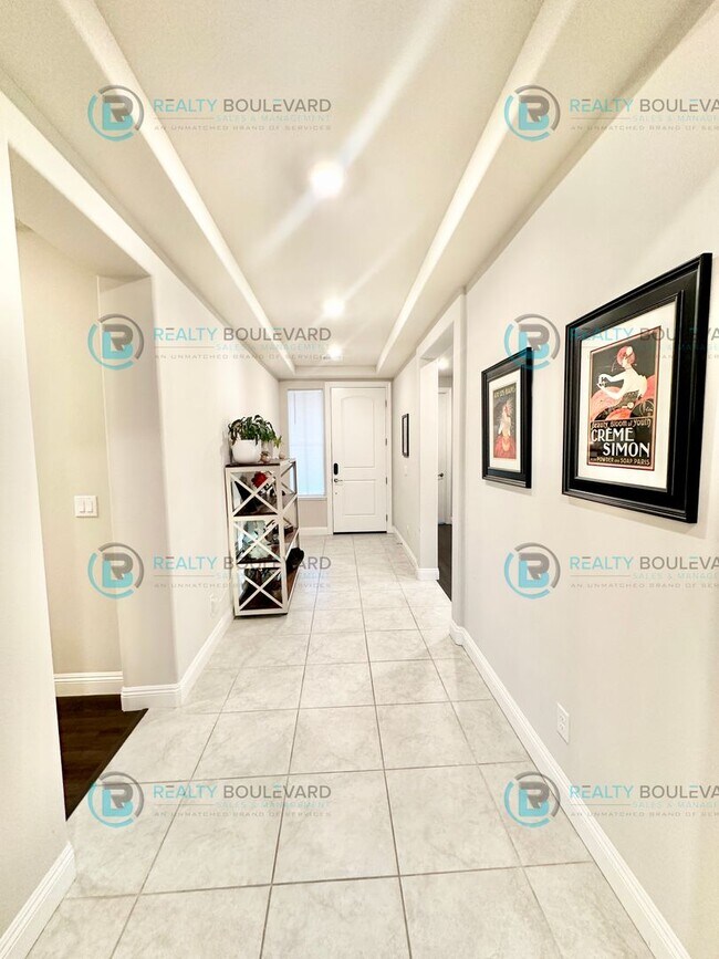 Building Photo - Welcome to your dream home, where modern elegance meets unparalleled convenience!