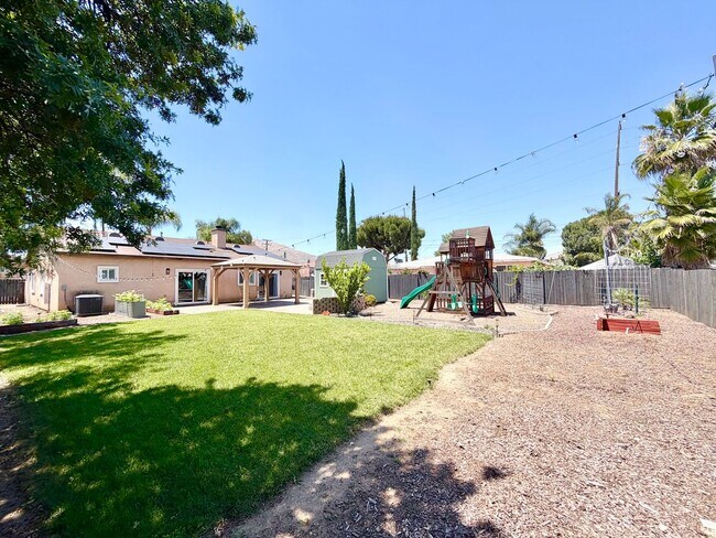 Building Photo - Beautifully Renovated 4 Bedroom Home with INCLUDED Solar, Large Backyard & Gazebo