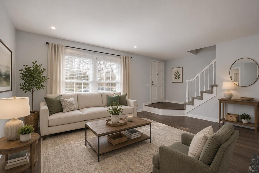 Inviting living room featuring abundant natural light, neutral finishes, and an open flow to the mai - 3000 Hillsboro Pike