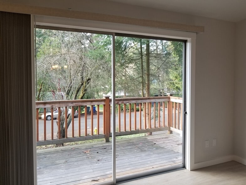 Living room acees to large deck overlooking nice peaceful front yard. - 4070 149th Ave SE