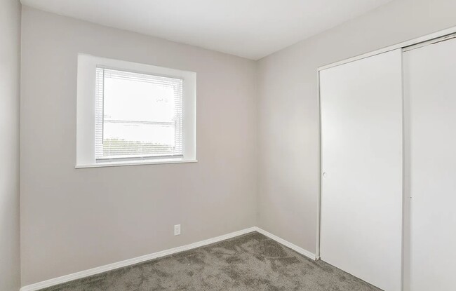 Fresh carpeted bedrooms with closet spaces and beautiful lighting as well. - 1902 E Calvert St