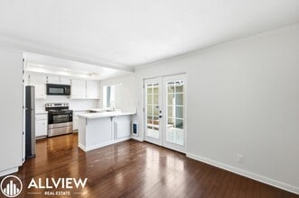Building Photo - Fully Renovated 2 Bed Townhome with Private Patio, 2-Car Garage & Community Pool