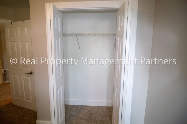 Building Photo - Spacious 3BR Townhome in Lowell | Nature Views & Maintenance-Free Living