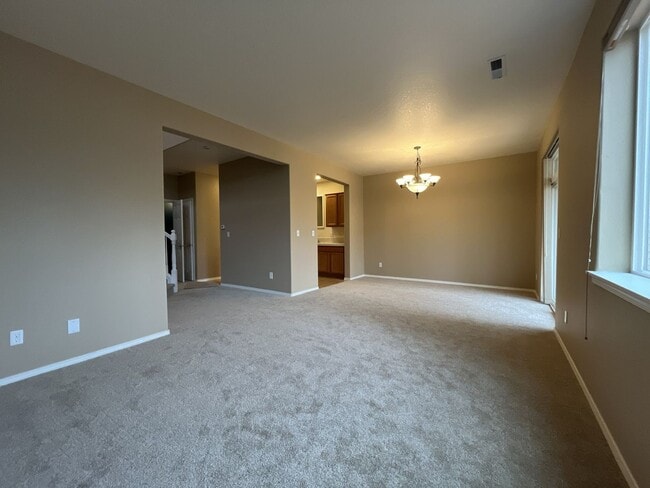 Building Photo - Inviting Two-Story 3BR Home Featuring New Carpet, New Stainless Appliances, Spacious Garage Stora...