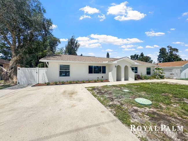 Building Photo - Tree-Lined 2BR/1BA Fort Myers Duplex with Fenced Yard, Storage Shed & In-Unit Laundry!