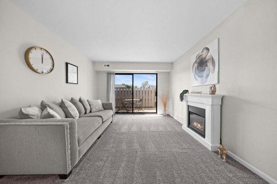 Living Room with Natural lighting at Three Oaks Apartments in Troy, MI - Three Oaks Apartments