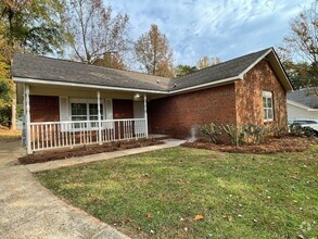 Building Photo - Introducing a charming 4-bedroom, 2-bathro...