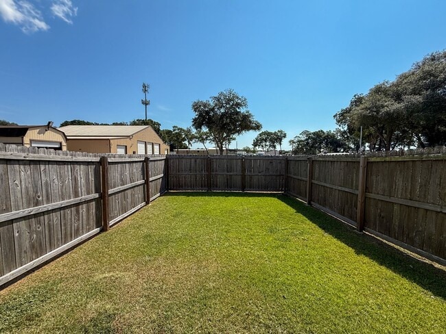 Building Photo - 3 bedroom 2.5 bath townhome tucked inside ...