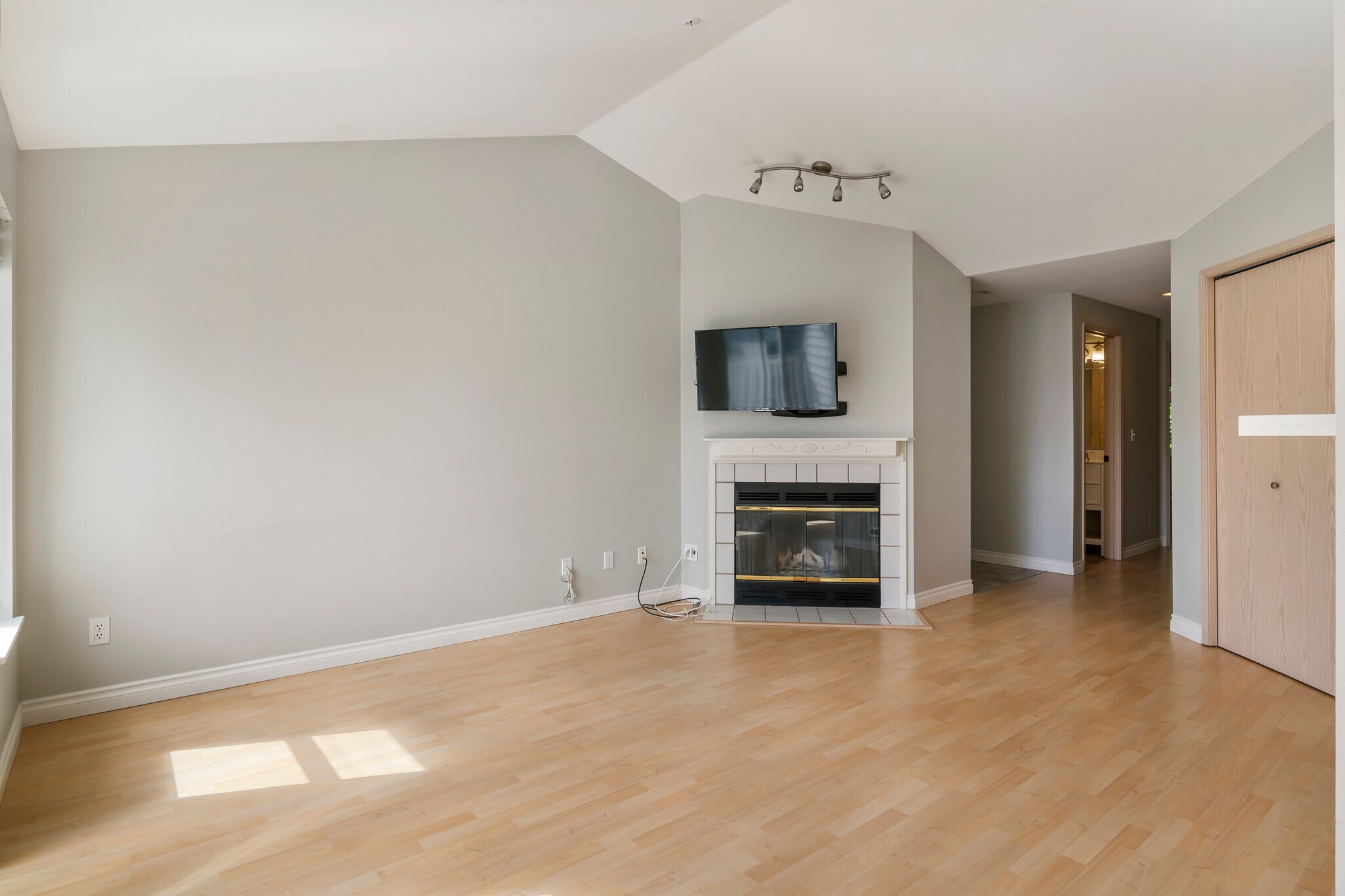 Vaulted Living Room with wood burning fireplace - 9910 NE 137th St