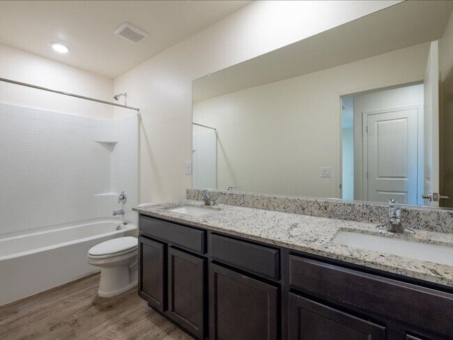 Building Photo - Spacious 4-Bedroom Home with Open Layout & Turf Backyard