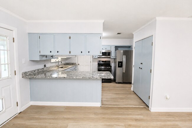 Building Photo - Spacious 4BR, 2BA Central Pensacola Home on a Large Corner Lot with Sunroom & 2-Car Garage