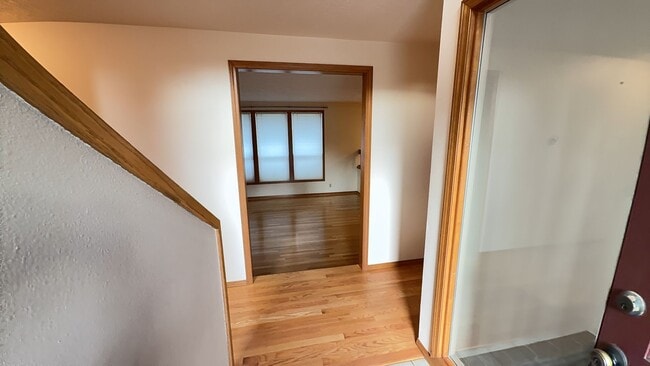 Building Photo - 4bd/3ba HUGE Home w/Hardwood Floors, Russian Fireplace, 2-Car Garage & Fenced Back Yard!