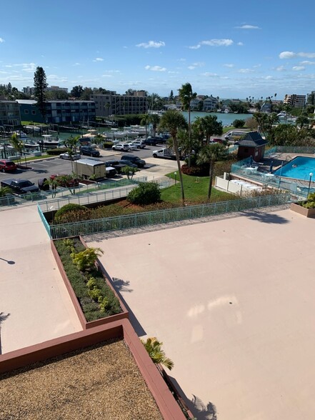 View from 4th floor breezeway- guest parking - 1 Key Capri Key