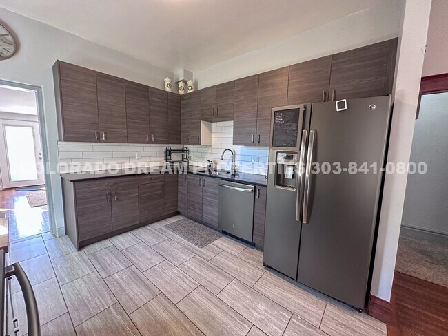 Building Photo - A home where old-world charm meets modern sophistication!