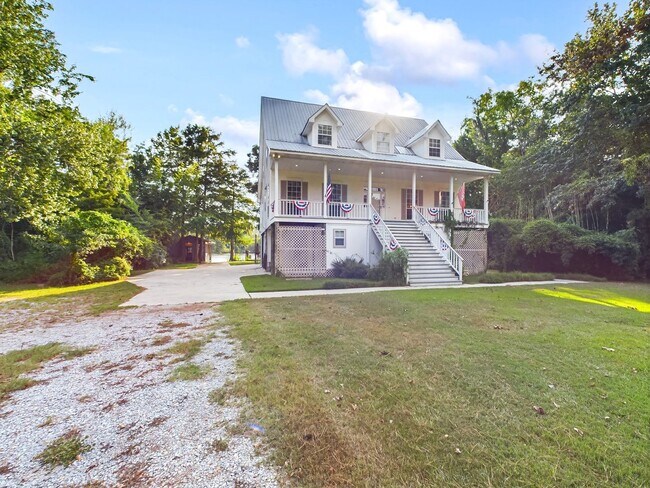 Building Photo - Private Furnished Riverfront Estate with Dock & Guest Apartment